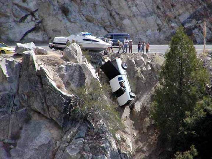Truck Hanging Over Cliff