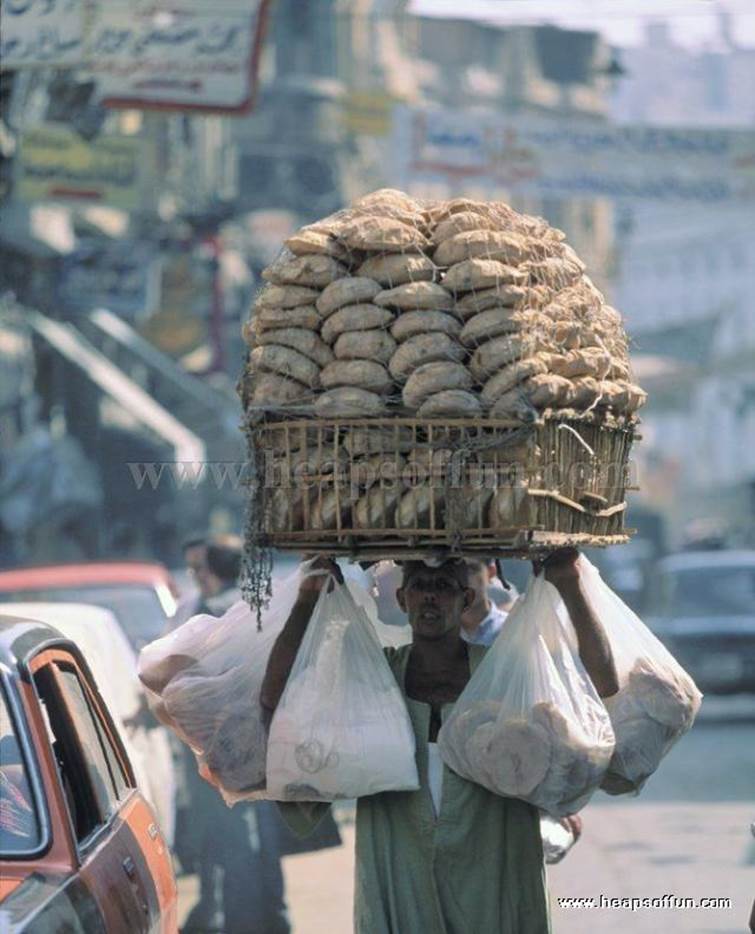 http://www.heapsoffun.com/pictures/2010/01/22/funny_people_carrying_things_on_head_m1008.jpg