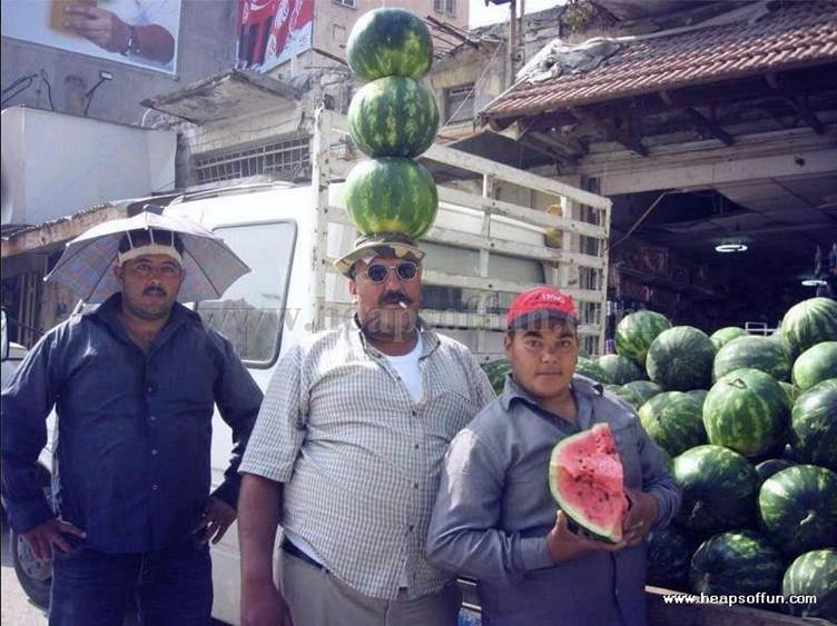http://www.heapsoffun.com/pictures/2010/01/22/funny_people_carrying_things_on_head_m1001.jpg