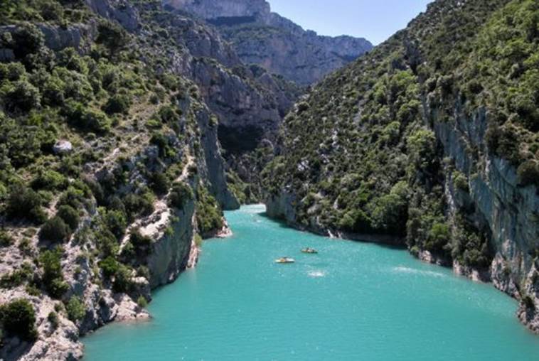 Verdon Gorge: In southeastern France, the Verdon River has eroded the land hundreds of feet down leaving limestone cliffs and caves in its wake and creating a massive gorge. The water is clean and a stunning turquoise blue, and in the summer months, a temperature perfect for swimming.