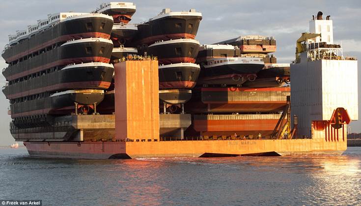 The ship of all ships: The largest cargo transport ship in the world, the Blue Marlin of Dockwise, carries four pontoons and 18 hulls on its back from Nantong Port, China