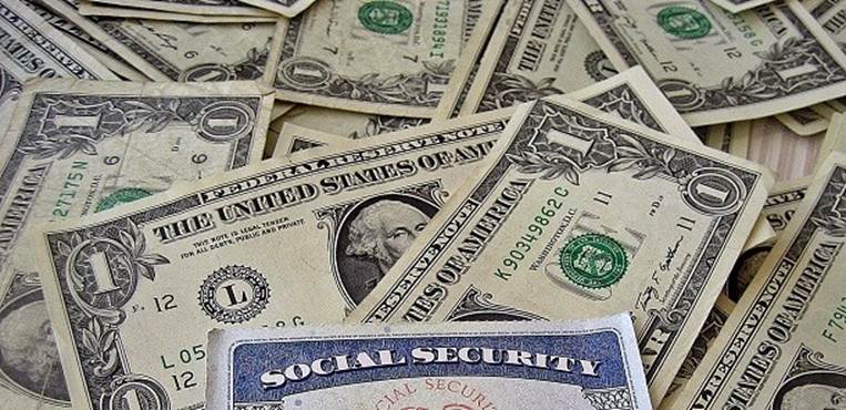 social security card with dollars