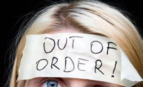 Woman Wearing Out of Order Sticker on Head : Stock Photo