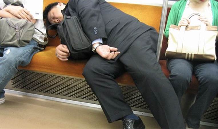 Businessmen passing out in public