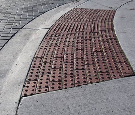 In some countries there are specific textures (tactile pavements) in the sidewalks that blind people can sense with their canes and use for guidance. These are especially useful near crosswalks and metros