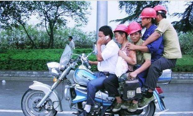 http://unsafepictures.com/Photo/Overloading/5%20on%20a%20motorcycle.jpg