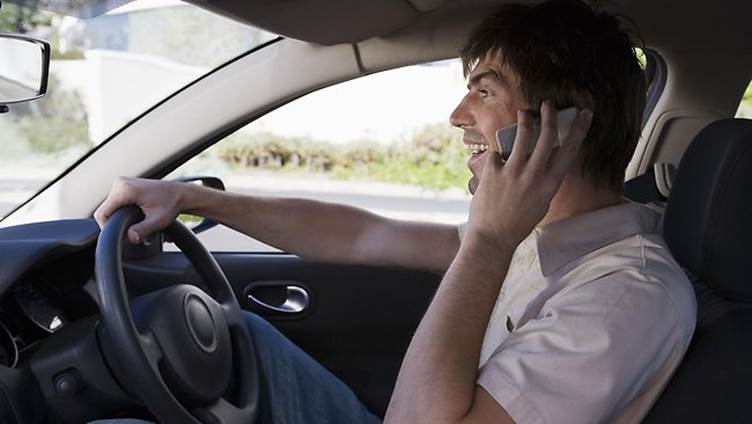 http://resources3.news.com.au/images/2013/07/28/1226586/335799-man-driving-while-on-phone.jpg