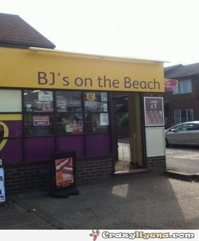 Sign over shop saying you can get BJ on the beach
