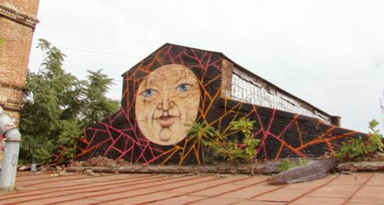 Round face graffitied on wall in Rostov-on-Don by Nikita Nomerz