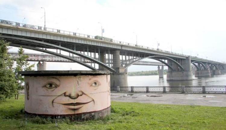 Street art face painted on riverside structure in Novosibirsk, Russia