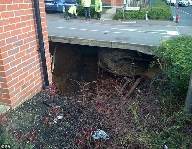 Concern: A 35ft wide hole appeared underneath a home in Hemel Hempstead last week, prompting the surrounding properties to be evacuated