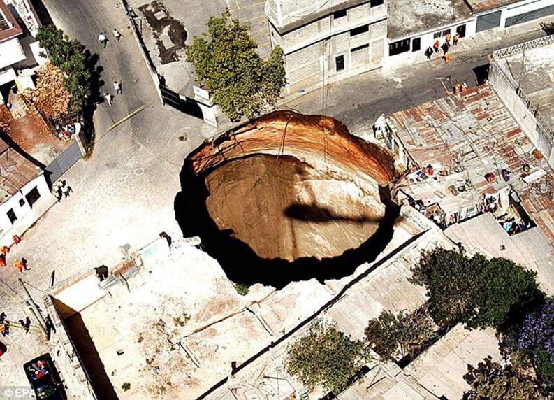 Vanished: 20 holes disappeared after a 150m-wide sink hole opened up in Guatemala
