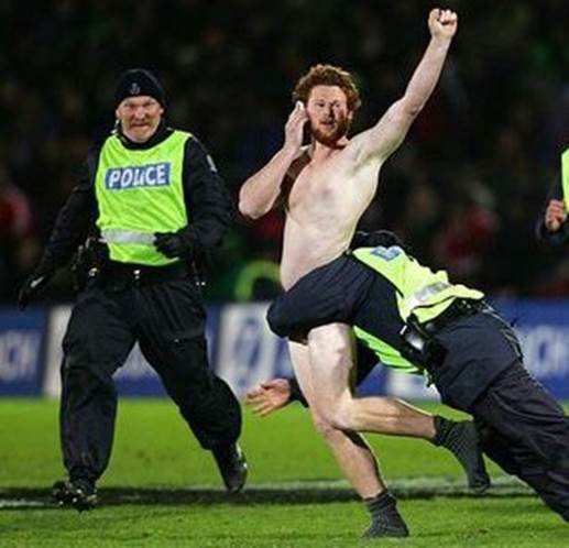 http://www.joke-of-the-day.com/files/images/security-tackles-streaker.jpg