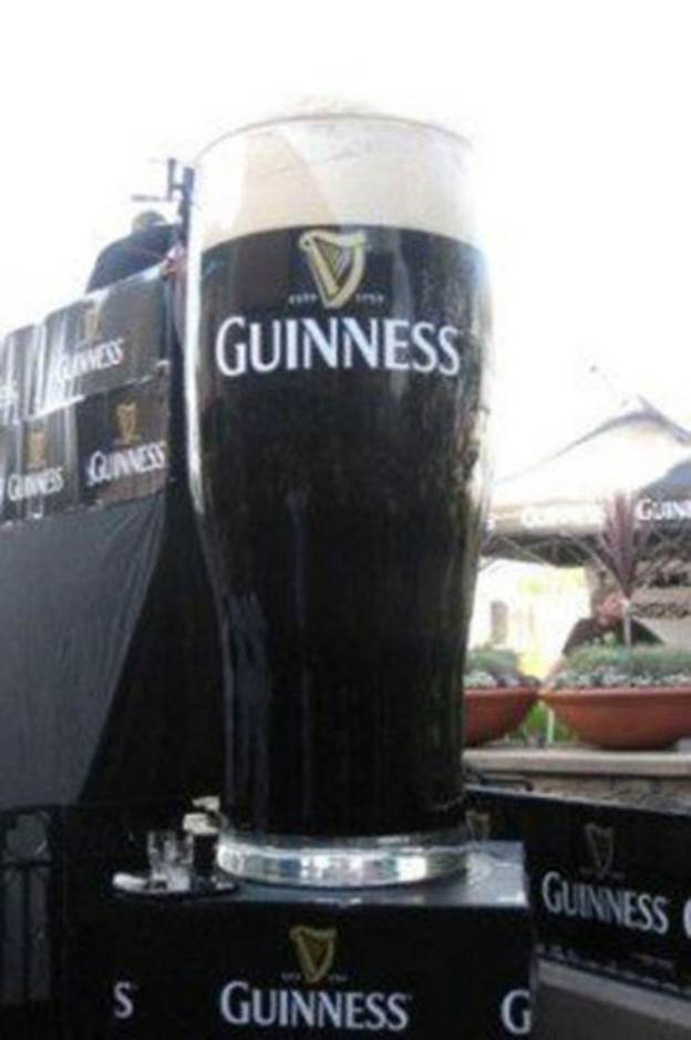 Largest "pint" of beer--Made by the Auld Dubliner Irish Pub in Tustin, California, this glass is 8 feet tall, weighs 900 pounds and is filled with 430 gallons (2,772 pounds) of beer.