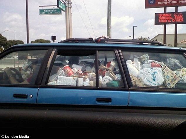Keeping moving: A vehicle filled with rubbish in the back is being driven on this road called Nebraska Avenue