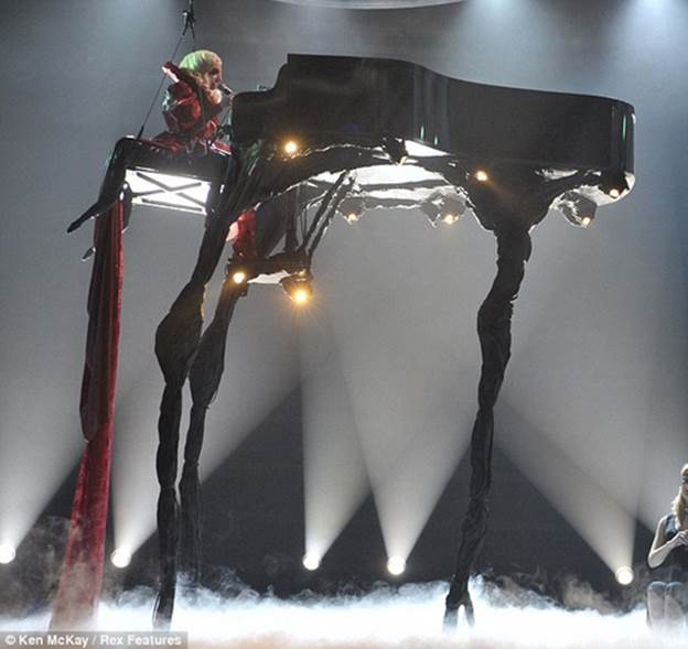 http://www.weirdomatic.com/wp-content/pictures/2011/07/lady-gaga-piano1.bmp