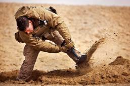 http://blog.4shtf.com/wp-content/uploads/2014/09/Defense.gov_News_Photo_120212-M-MM918-007_-_U.S._Marine_Lance_Cpl._David_Manning_digs_a_foxhole_at_his_platoon_s_defensive_position_during_Operation_Shahem_Tofan_Eagle_Storm_in_the_Garmsir.jpg