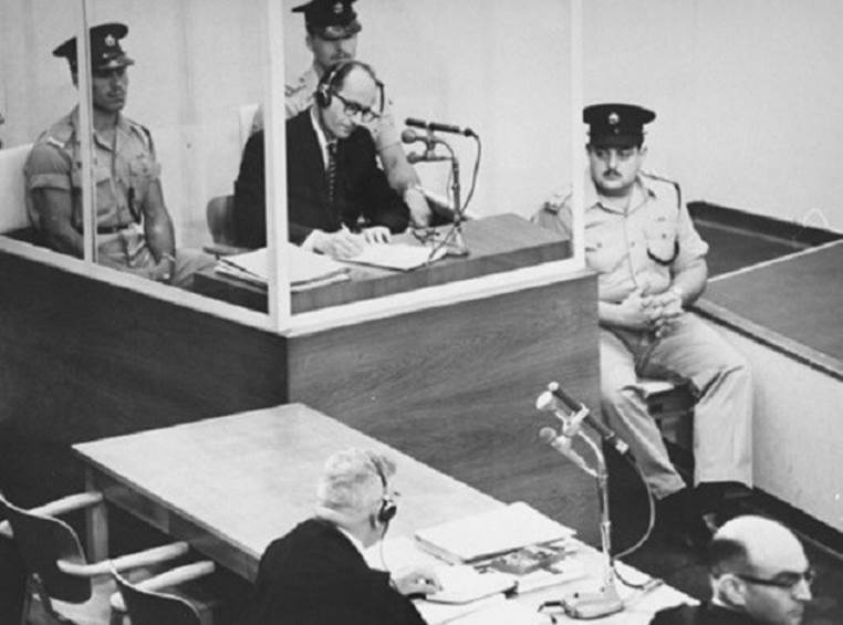 Adolf_Eichmann_takes_notes_during_his_trial_USHMM_65268.jpg Oct