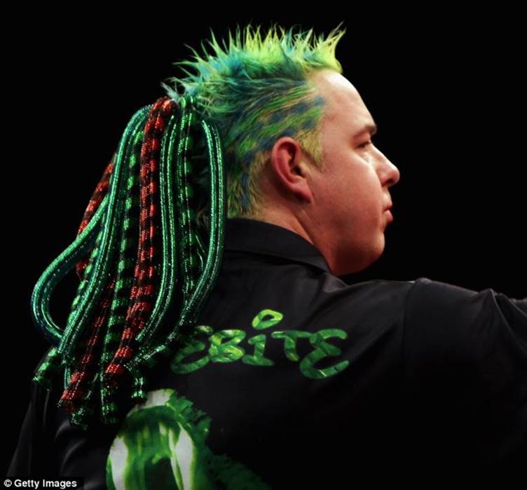Peter Wright competes with Phil 'The Power' Taylor at Alexandra Palace