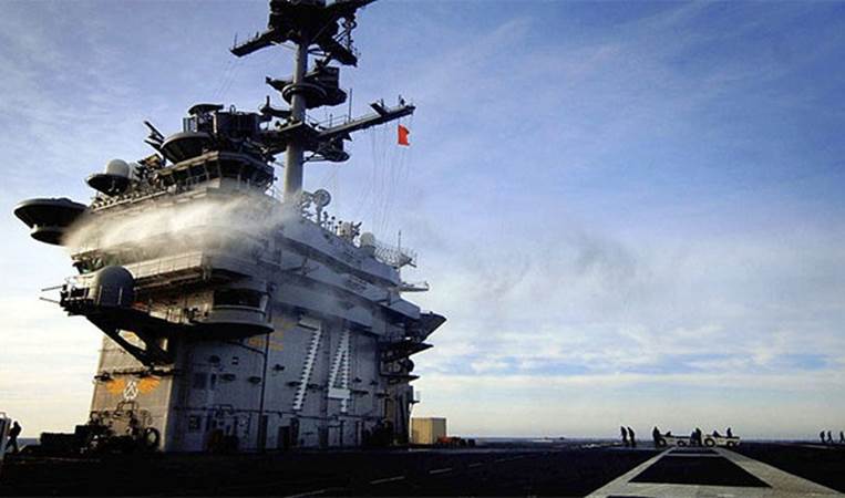 The command structure that you see rising out of the deck of an aircraft carrier is known as the 