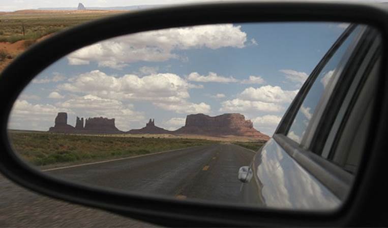 If you can see your own car in your mirror, the mirror is in a potentially dangerous position. To avoid having blind spots it's better not to have any part of your own car visible