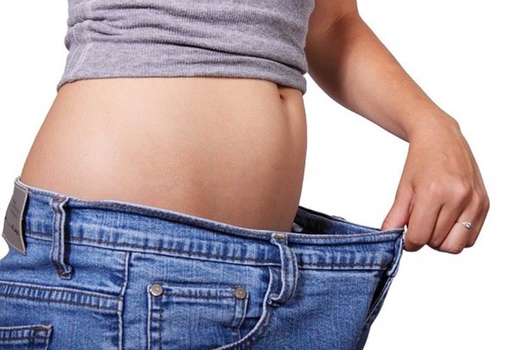 woman with larger jeans weight loss