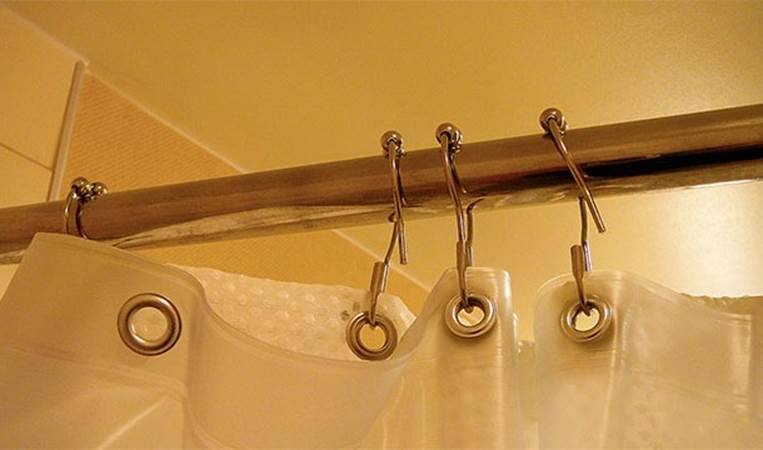Extra shower curtain rods are also a good way to add space within the shower area