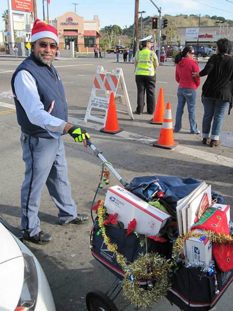 usps_mail_carrier_wrapped_in_christmas